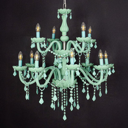 Large green crystal chandelier shown on black background highlighting bold vibrant details for elegant interior ceilings.