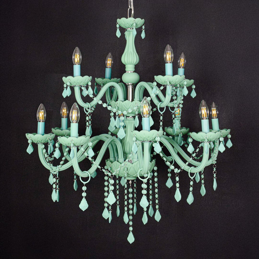 Large green crystal chandelier shown on black background highlighting bold vibrant details for elegant interior ceilings.