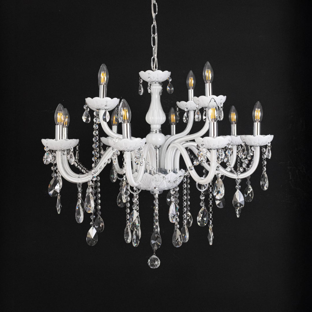 Classic white chandelier with crystal droplets displayed off against black background for elegant home decor style.