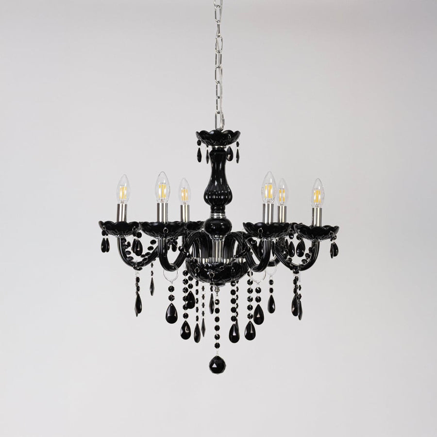 Classic black chandelier with crystal droplets displayed off on white background for stylish luxury lighting.