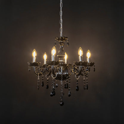 Black crystal chandelier with illuminated candle bulbs and cascading crystal accents creating dramatic luxury ambient lighting.
