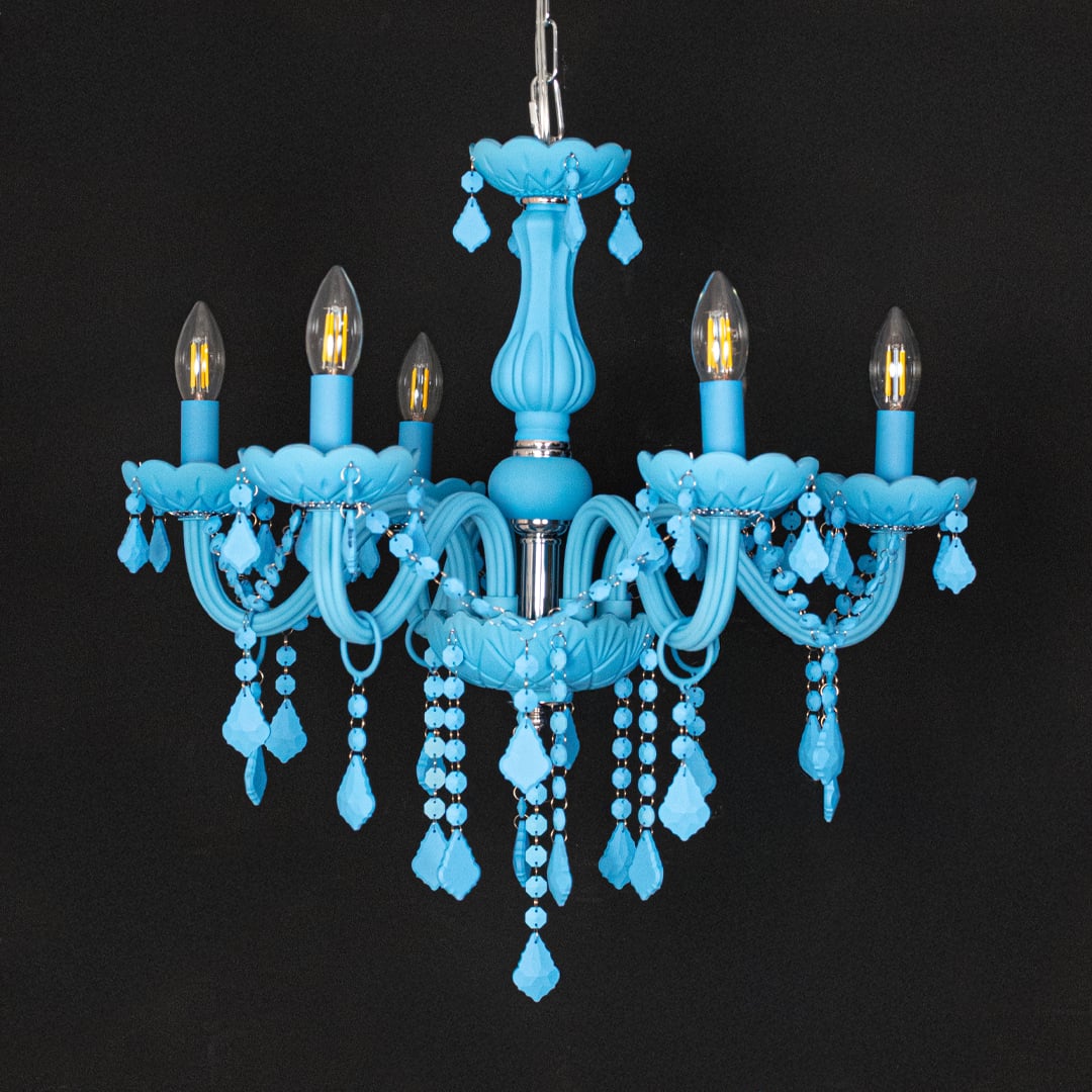 Blue crystal chandelier displayed on black background highlighting bold vibrant detailing for premium ceiling decor.