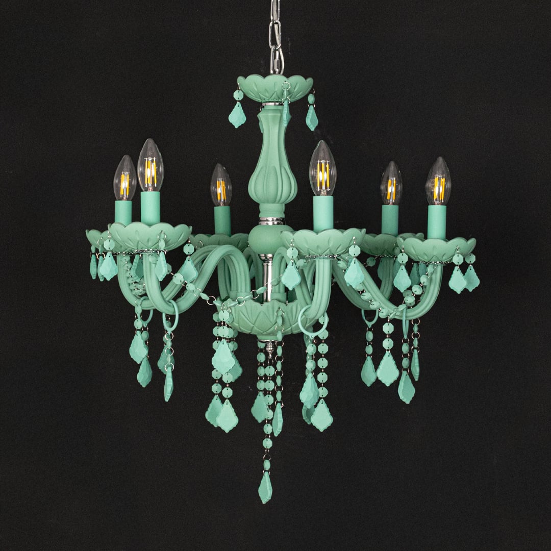 Green crystal chandelier shown on black background highlighting bold vibrant details for elegant interior decor.