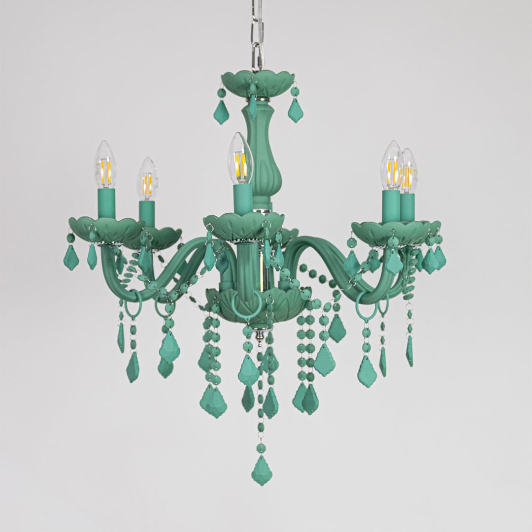 Green crystal chandelier displayed on white background ideal for colorful bright interior ceiling styling.