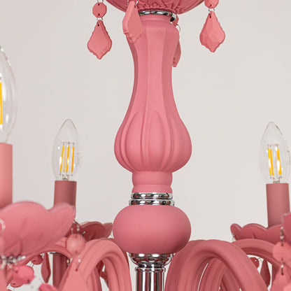 Closeup of pink crystal chandelier with detailed beads and curved arms perfect for stylish luxury ceiling lighting.