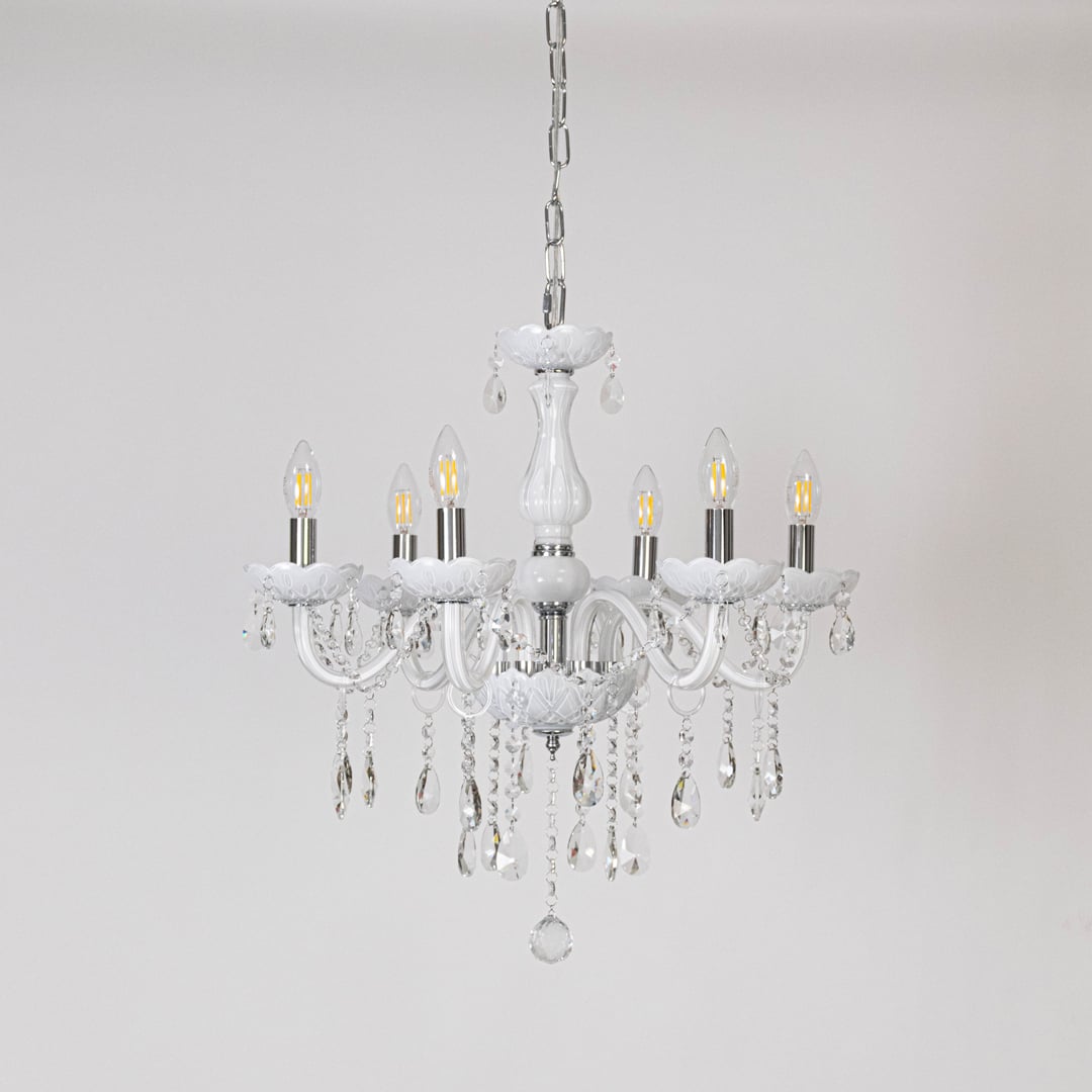 Classic white chandelier with crystal accents displayed off on white background for stylish luxury lighting.
