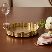 Gold metal decorative serving tray lifestyle image for elegant festive dining table presentation decor.