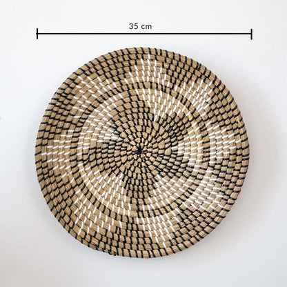Handwoven round wall basket in natural black tones showing 30 cm diameter designed for decorative interior wall decor placement.