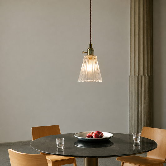 Lifestyle image of bimbo glass hanging light for elegant modern dining room decor styling and luxury interior lighting.