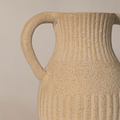 Close-up of twin handle vase showing ribbed ceramic detailing and organic handcrafted texture.