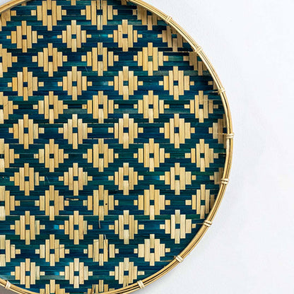 Closeup of handcrafted blue and natural seagrass wall basket with geometric woven pattern for artisan home décor.