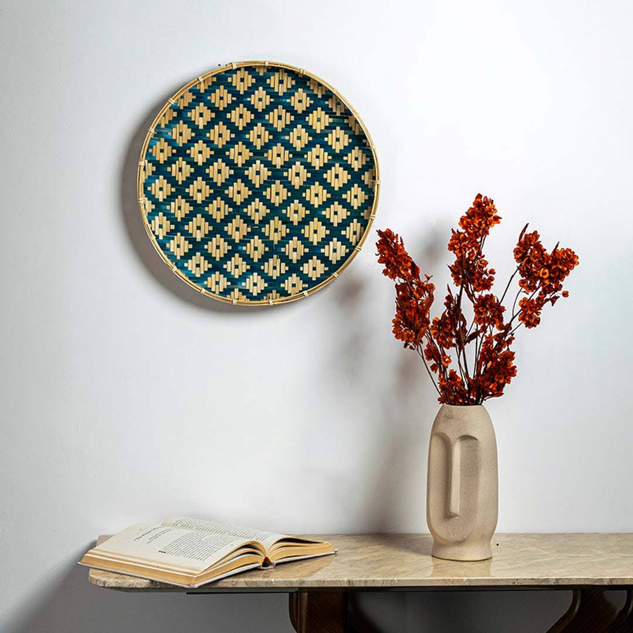 Handcrafted blue and natural seagrass wall basket for living room shelf and modern boho home décor styling.