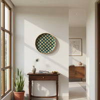 Colorful round wall decor with geometric pattern mounted above wooden console adding playful character to contemporary home decor space.