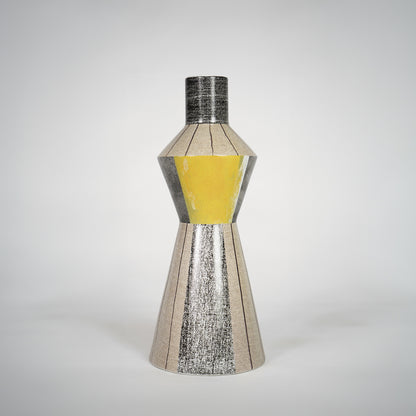Silver textured glass vase with yellow center for elegant console table placement and luxury indoor decor styling.
