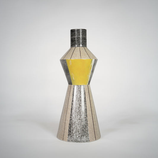 Silver textured glass vase with yellow center for elegant console table placement and luxury indoor decor styling.