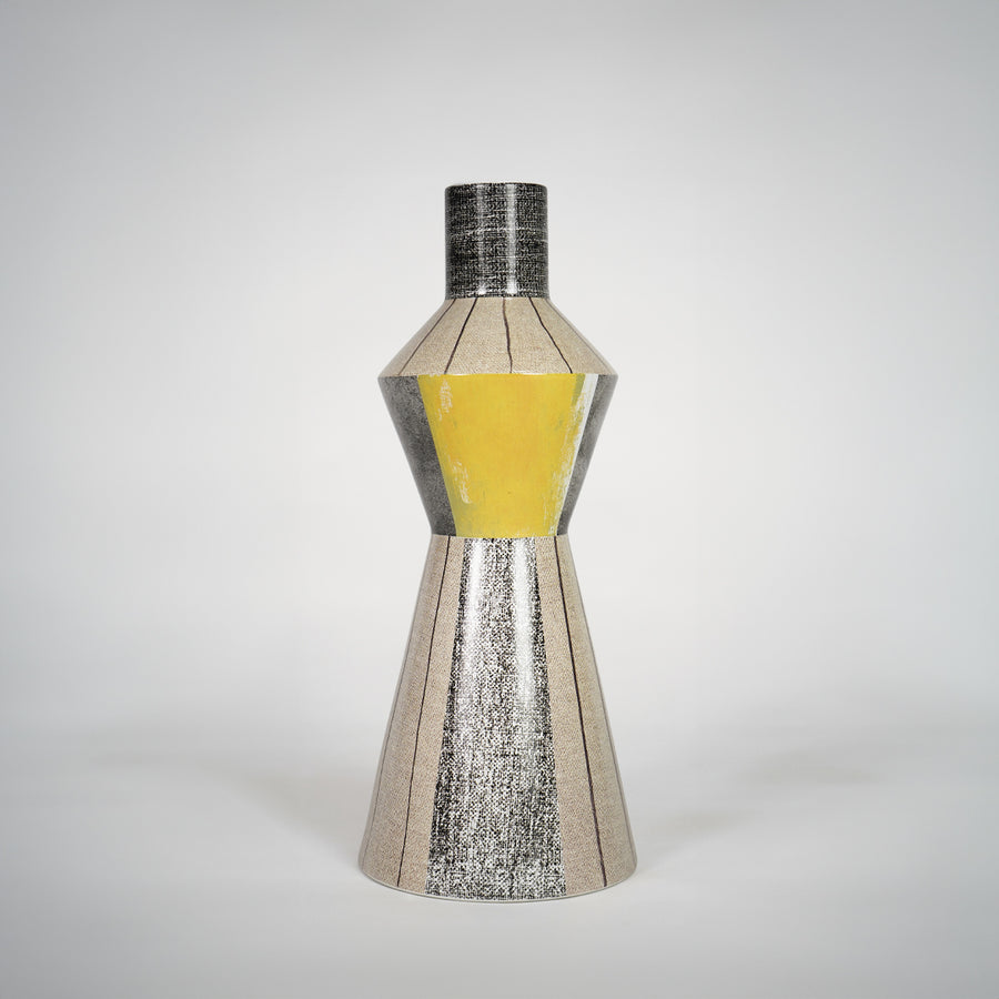 Silver textured glass vase with yellow center for elegant console table placement and luxury indoor decor styling.