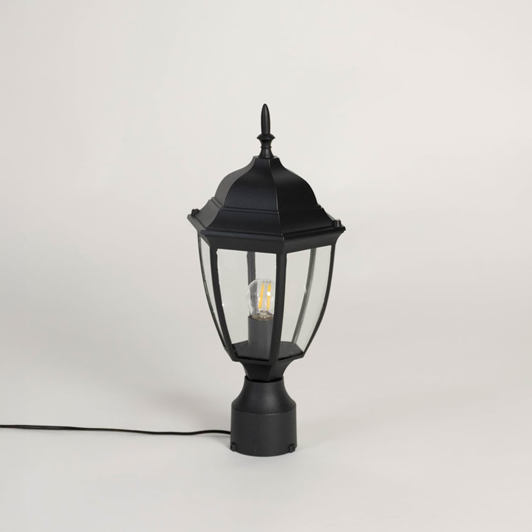 Stylish black outdoor pillar lamp with transparent glass panels designed for modern patio garden and balcony lighting.