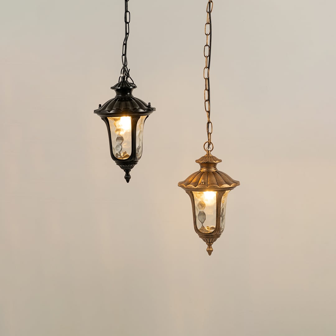 Grouped view of black metal lanterns with lights on creating warm inviting glow perfect for outdoor patio walkway and entrance Decor.