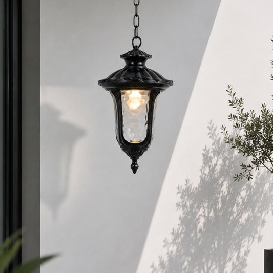 Black metal outdoor hanging lantern for porch entrance patio and covered balcony with warm ambient lighting.
