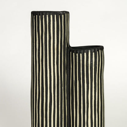 Detailed top view of black striped ceramic vase showing twin openings and handcrafted ribbed surface.