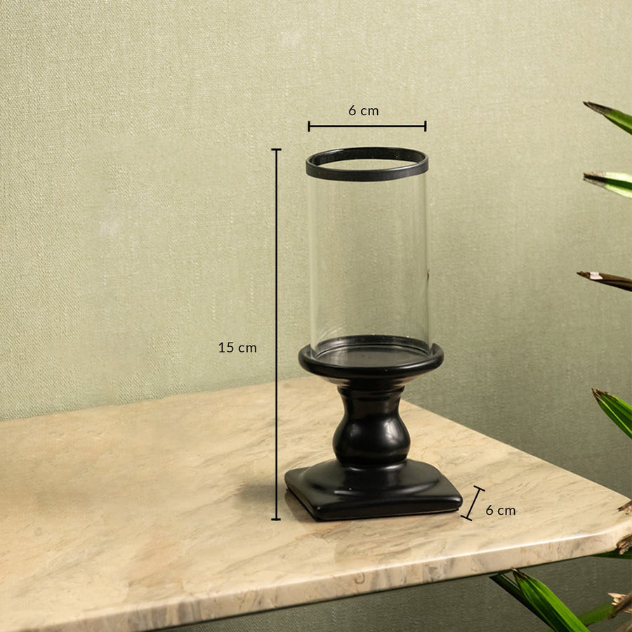 Dimension image of black metal candle holder with clear glass hurricane showing 15 cm height and 6 cm width.