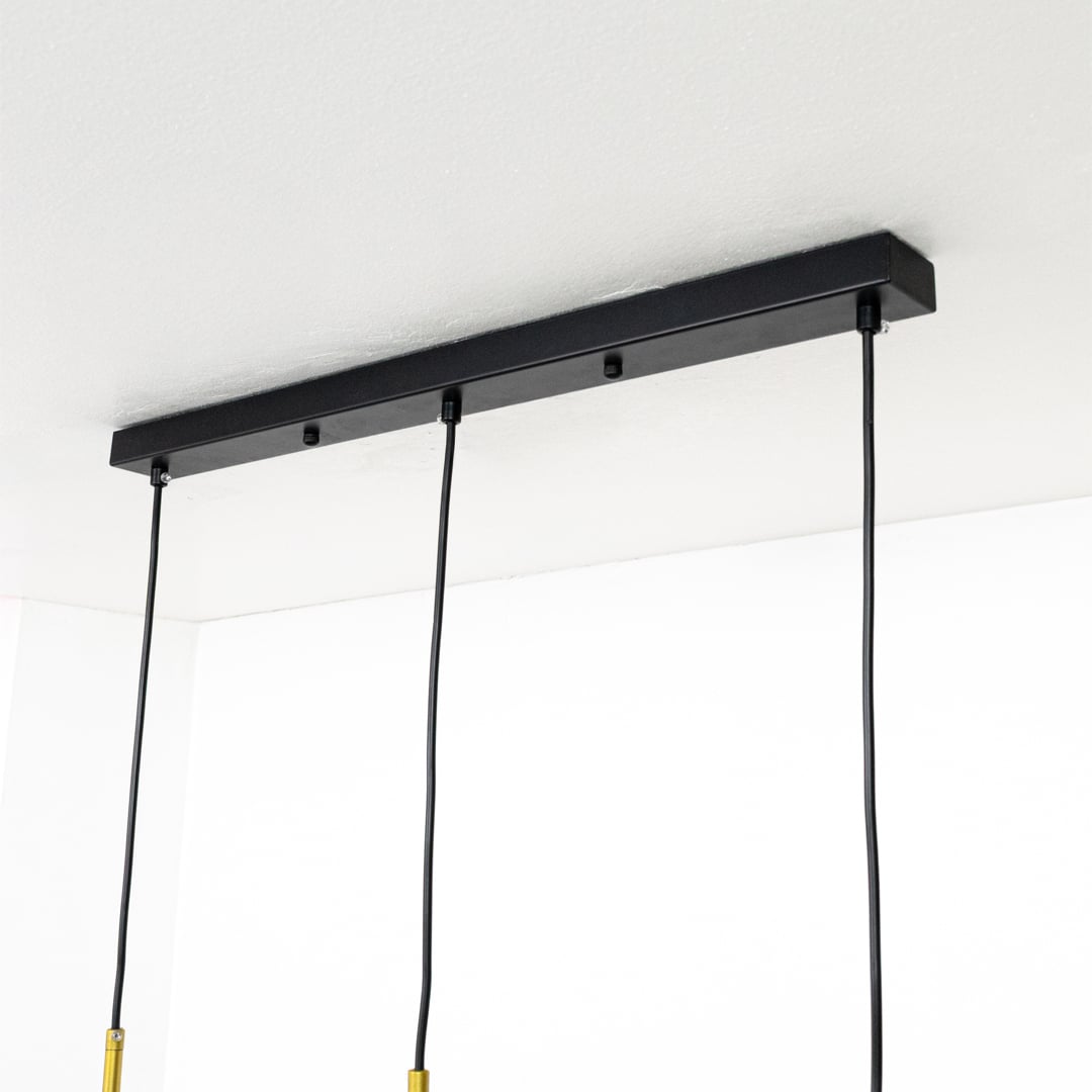 Closeup view of colorful pendant light showing gold metal details frosted globe and bright pastel shades for a stylish modern decorative lighting accent.
