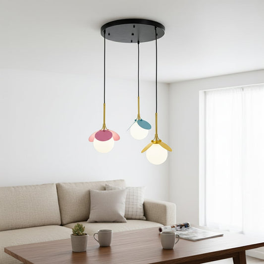 Colorful flower inspired pendant light with pink blue and yellow metal petals and frosted globes creating a playful modern room ambiance.