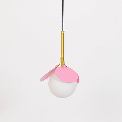 Pendant light with pink shade and frosted glass globe shown switched off with gold holder on plain white background.