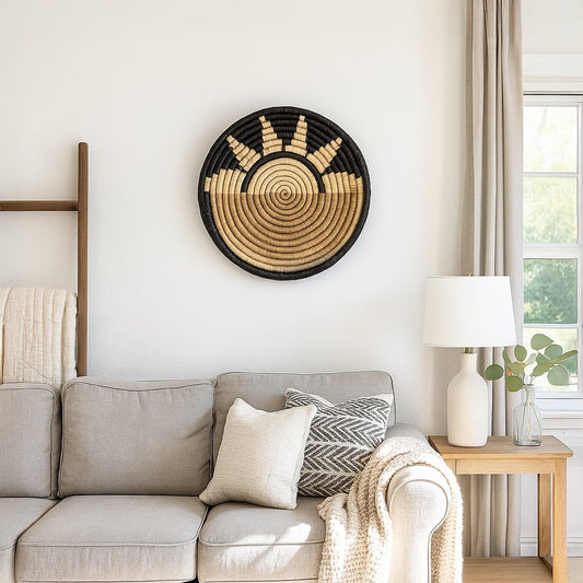 Black and gold woven wall basket mounted above sofa creating elegant contrast and refined accent for modern living room Decor.