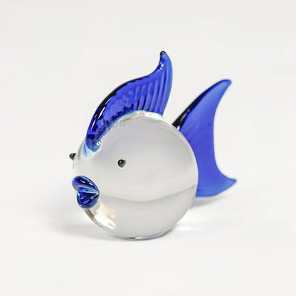 Blue and white glass fish figurine with vibrant curved fins isolated on clean white background for artistic home decor use.