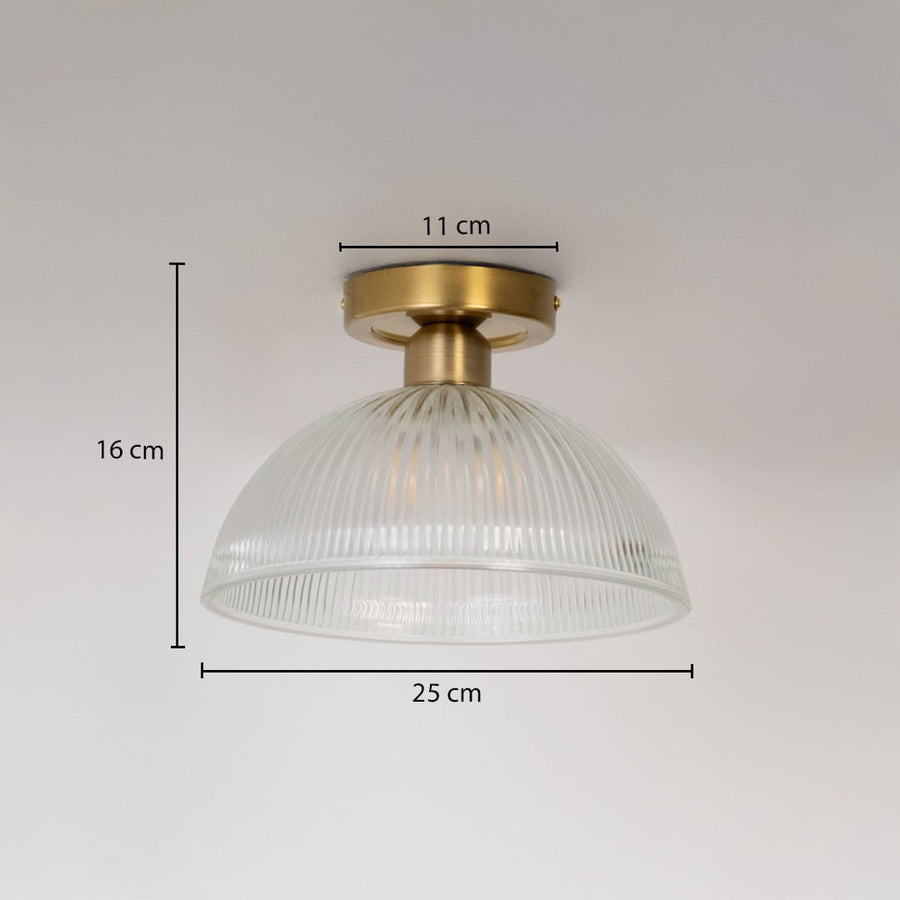 Ceiling light with brushed gold base and ribbed glass dome shade shown with size dimensions 16 cm height 25 cm width and 11 cm base.