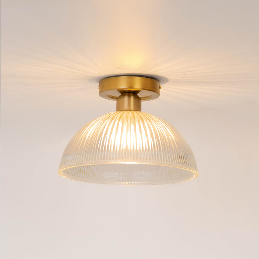 Modern gold metal ceiling light with frosted white glass globe for luxury living room and premium decor spaces.