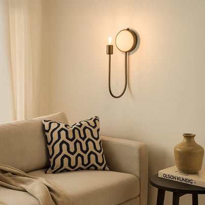 Designer metal and marble wall lamp adding sophisticated glow with curved silhouette ideal for hallways bedrooms or living room decor.