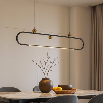 Modern chandelier displayed in a bright room showing its sleek oval frame and gold accents creating a stylish contemporary vibe.