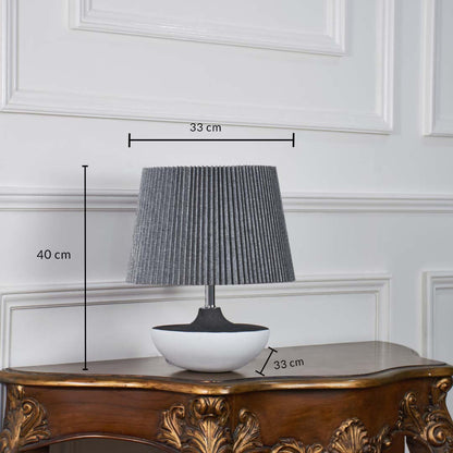 Black and white ceramic table lamp shown with 40 cm height and 33 cm shade width and 33 cm base width on a wooden console for accurate size reference.