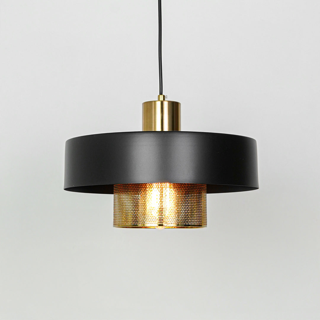 Modern black and gold pendant light suspended on white background for stylish dining room decor styling.