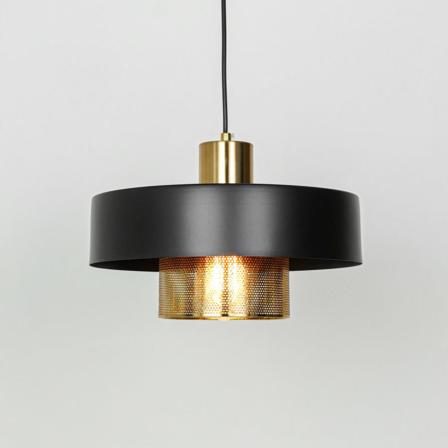 Modern black and gold pendant light suspended on white background for stylish dining room decor styling.