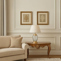 Modern floor lamp with chrome stand and white lampshade styled in a contemporary living room – elegant home lighting.
