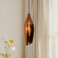 Lifestyle image of metallic red brilliance beam glass hanging pendant light for elegant dining room decor styling and modern home lighting design.