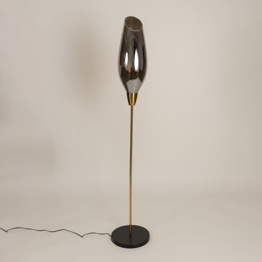 Smoke grey glass floor lamp with gold metal stand shown switched off on a clean white background highlighting its modern sculptural profile suited for interior decor styling.