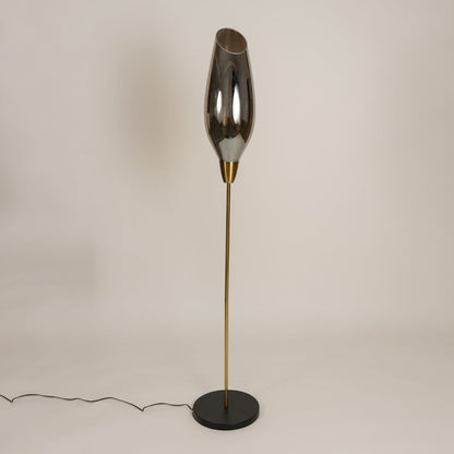 Smoke grey glass floor lamp with gold metal stand shown switched off on a clean white background highlighting its modern sculptural profile suited for interior decor styling.