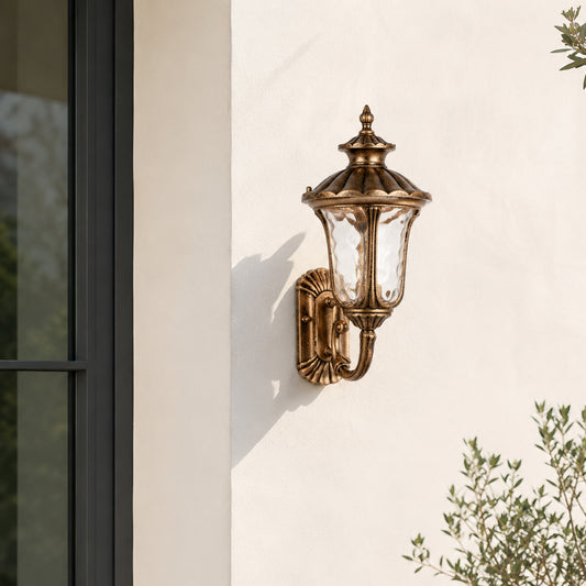Classic brass metal outdoor wall lantern for porch entrance garden and exterior walls with warm ambient lighting.