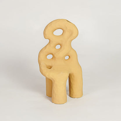 Contemporary mustard ceramic flower vase with unique sculpted design perfect for entryway table living room decor display.