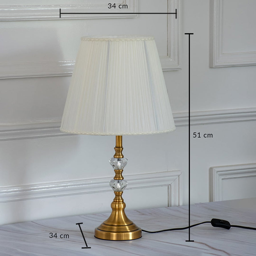 Classic table lamp with gold metal base and white fabric shade showing 51 cm height and 34 cm shade width for tabletop placement.
