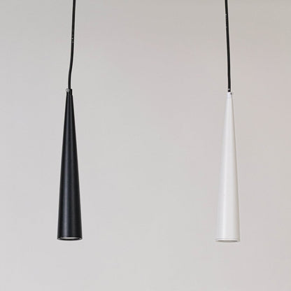 Set of black and white cone pendant lights in matte metal finish switched off on white background for minimal home décor.