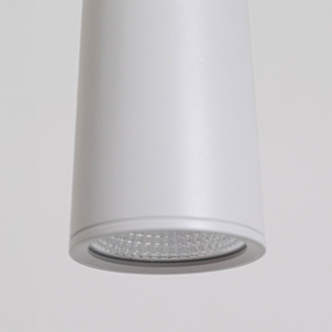 Detailed closeup of matte white metal pendant light showcasing the textured diffuser and premium minimalist design.