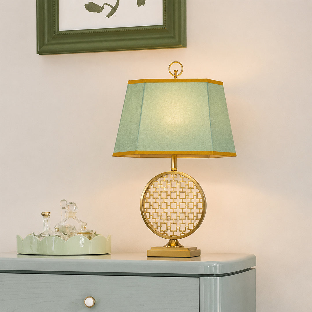Blue and white ceramic table lamp with fabric shade creating timeless traditional decor and warm ambient lighting.