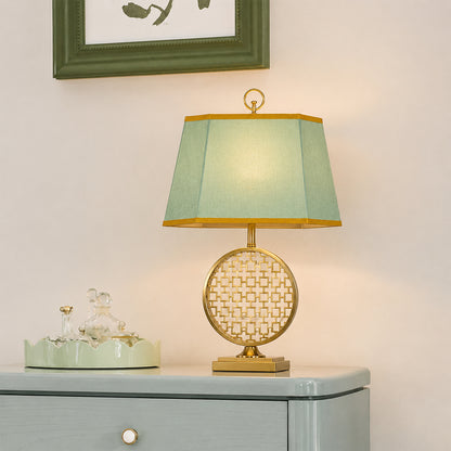 Blue and white ceramic table lamp with fabric shade creating timeless traditional decor and warm ambient lighting.