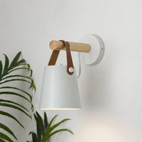 Modern white metal spotlight wall light with wooden accents for cozy contemporary interior decor.