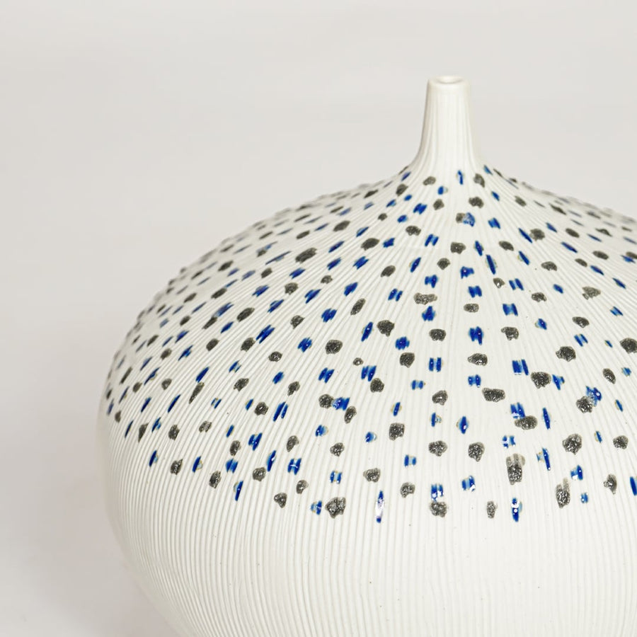 White ceramic decorative vase with detailed dotted blue and black pattern perfect for elegant dried floral display and interior decor.